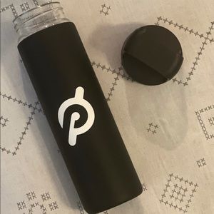 Peloton glass bottle with silicone sleeve.
